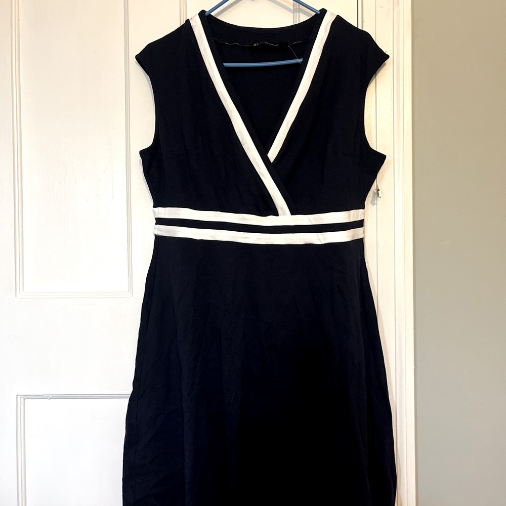 Navy blue fake wrap dress with white border.